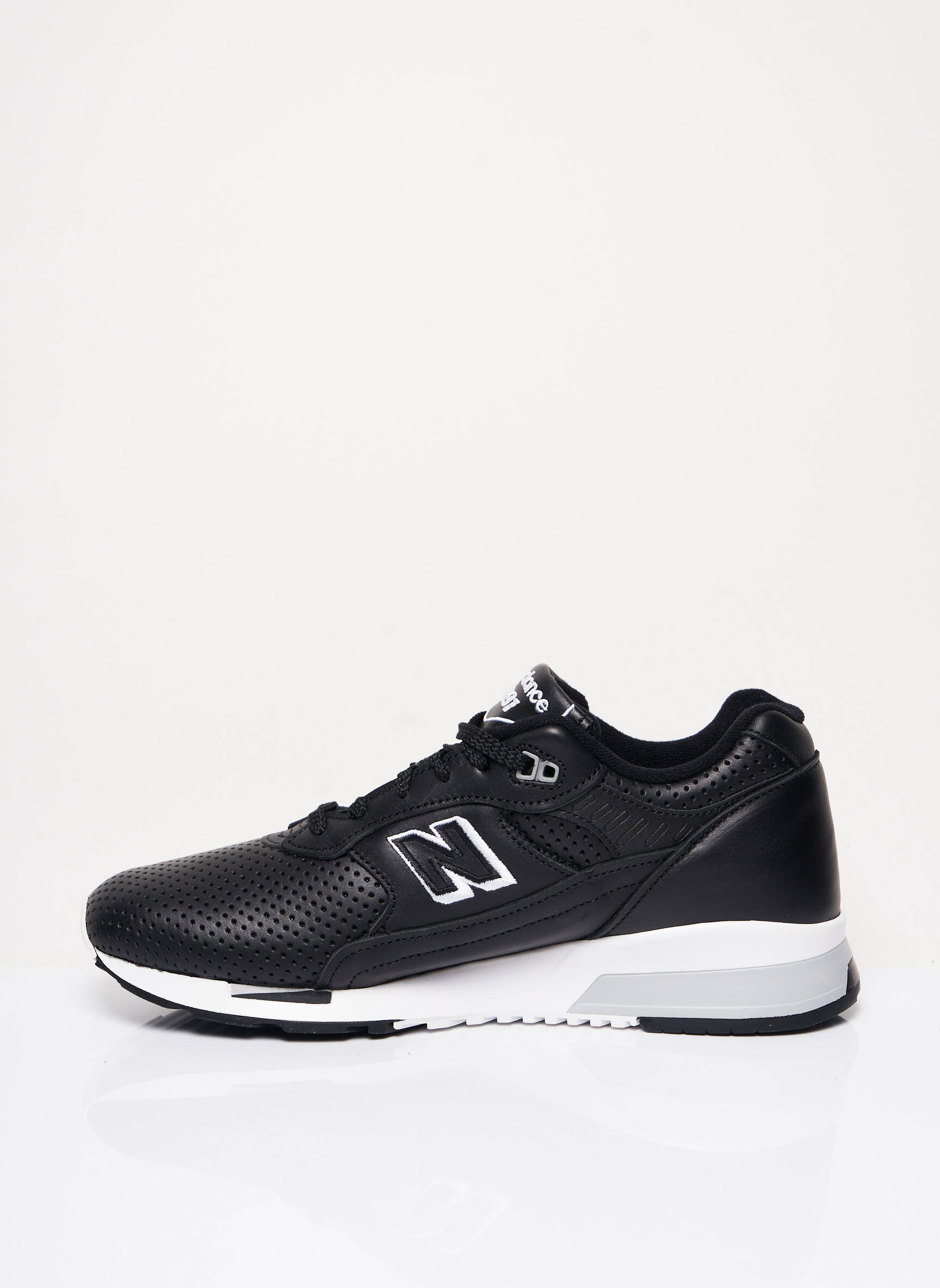 Baskets matière lisse talon compensé noir NEW BALANCE homme