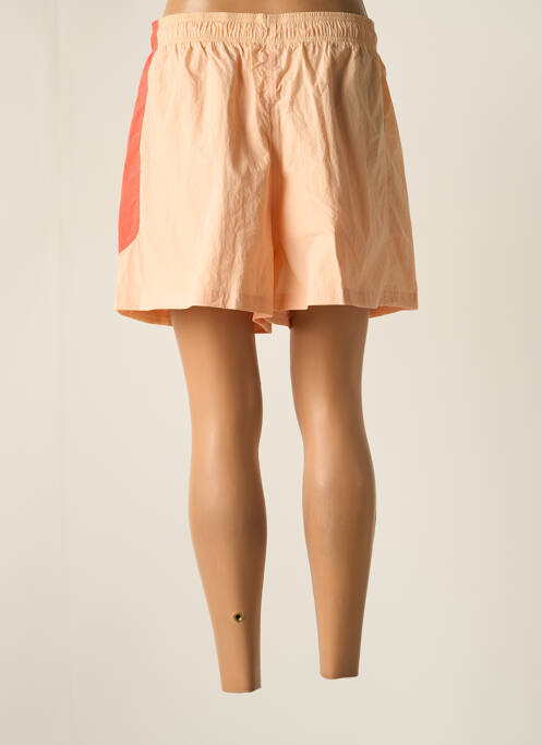 Short orange REEBOK pour femme